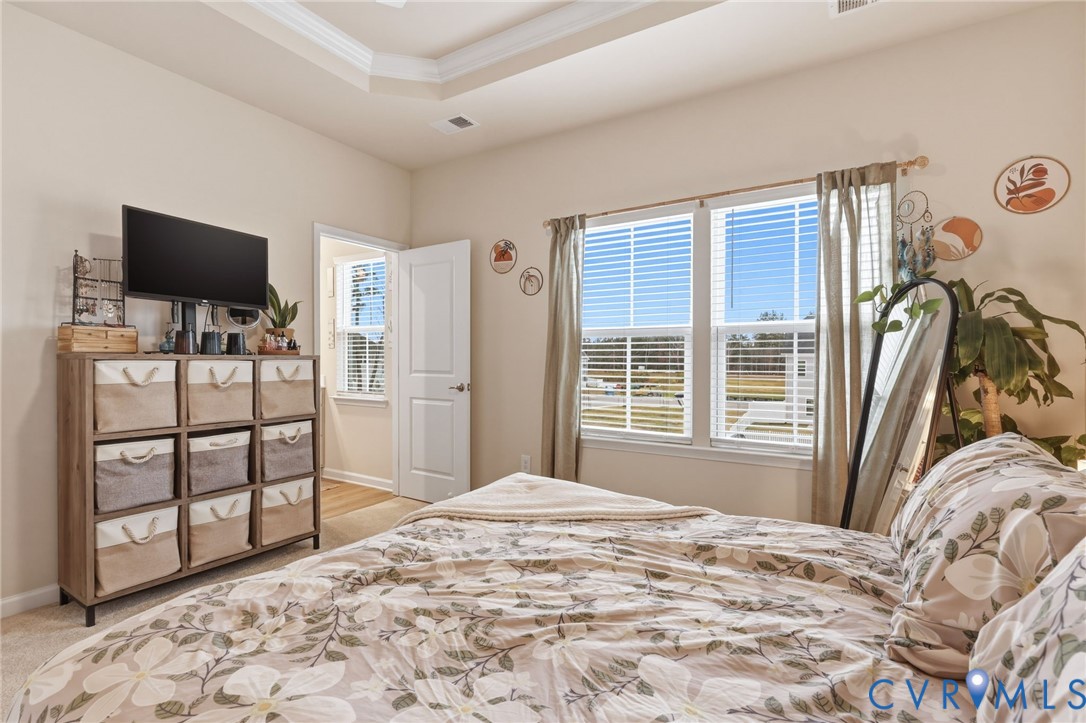 2031 Turtle Parkway Sandston, VA 23150 - Photo 15 of 26 a bedroom with a bed and a flat screen tv