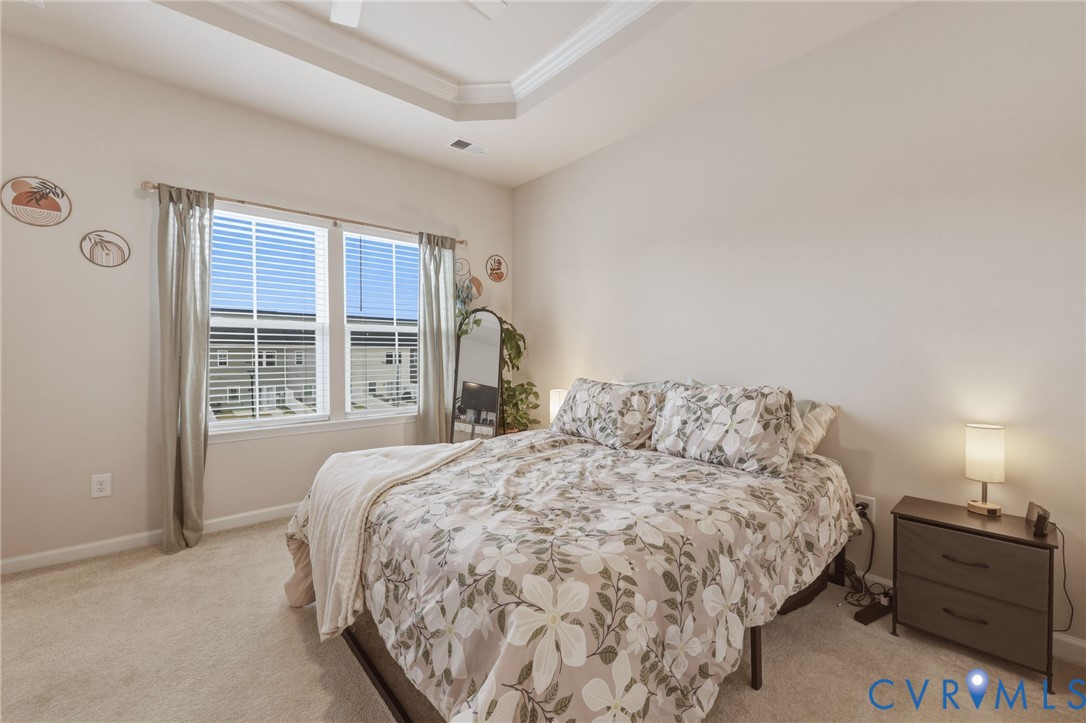 2031 Turtle Parkway Sandston, VA 23150 - Photo 16 of 26 a bedroom with a bed and a large window