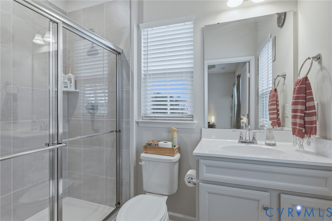 2031 Turtle Parkway Sandston, VA 23150 - Photo 17 of 26 a bathroom with a sink toilet and shower