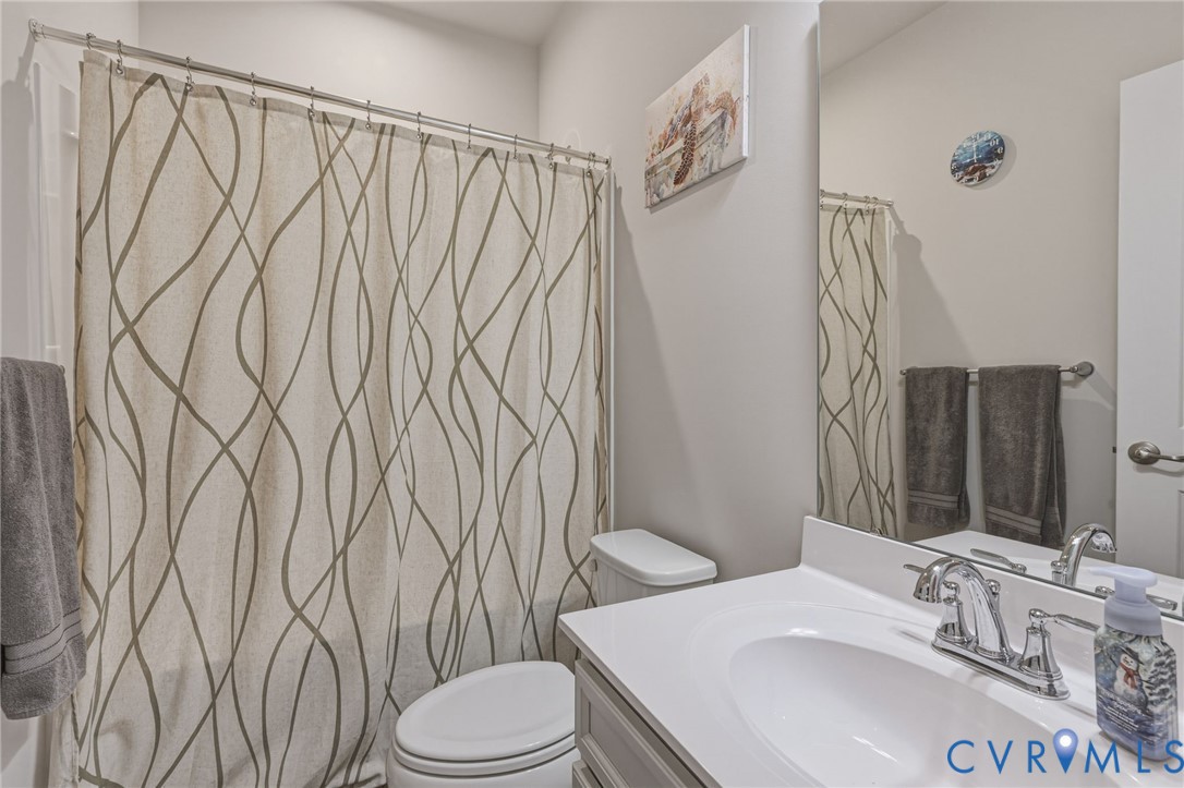 2031 Turtle Parkway Sandston, VA 23150 - Photo 20 of 26 a bathroom with a sink toilet and shower
