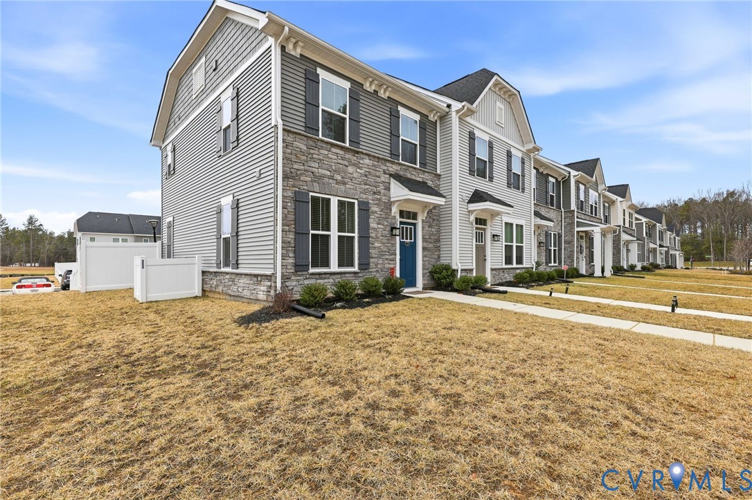 2031 Turtle Parkway Sandston, VA 23150 - Photo 25 of 26 a front view of a house with a yard