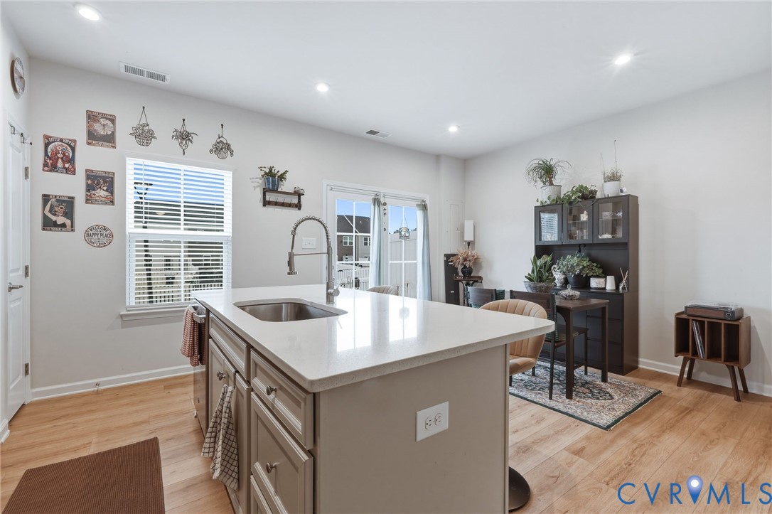 2031 Turtle Parkway Sandston, VA 23150 - Photo 7 of 26 a kitchen with stainless steel appliances granite countertop a sink and a refrigerator