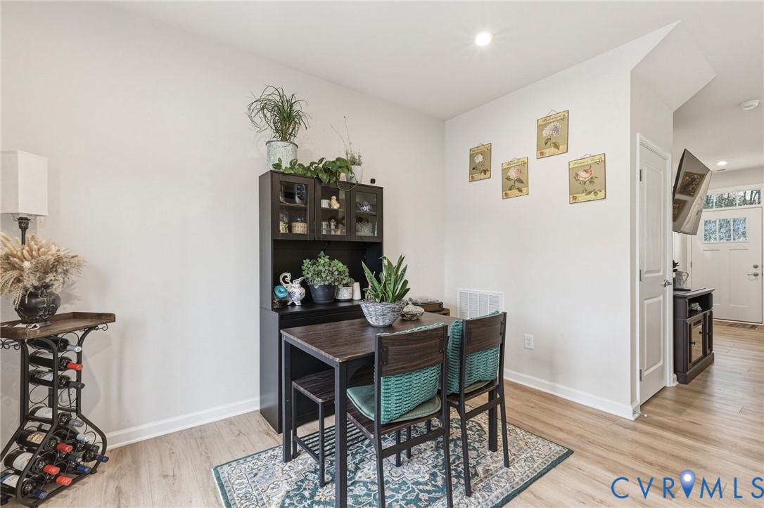 2031 Turtle Parkway Sandston, VA 23150 - Photo 10 of 26 a dining room with furniture and wooden floor