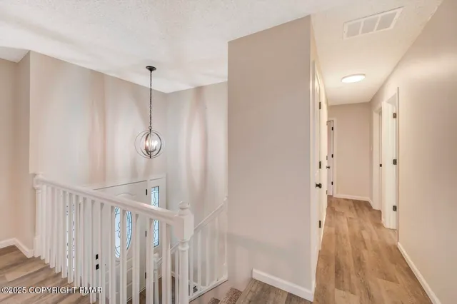 a bathroom with a sink vanity and a mirror