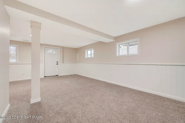 a bathroom with a shower and a glass door