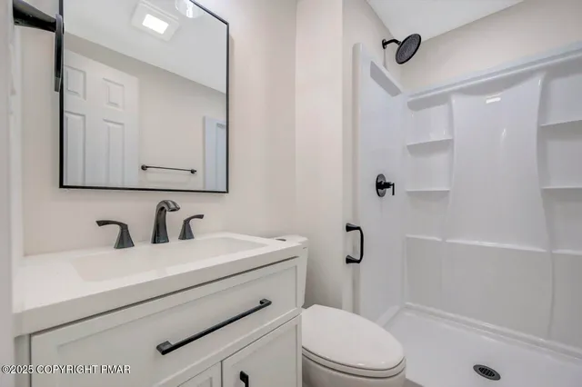 a view of backyard with a garden and deck