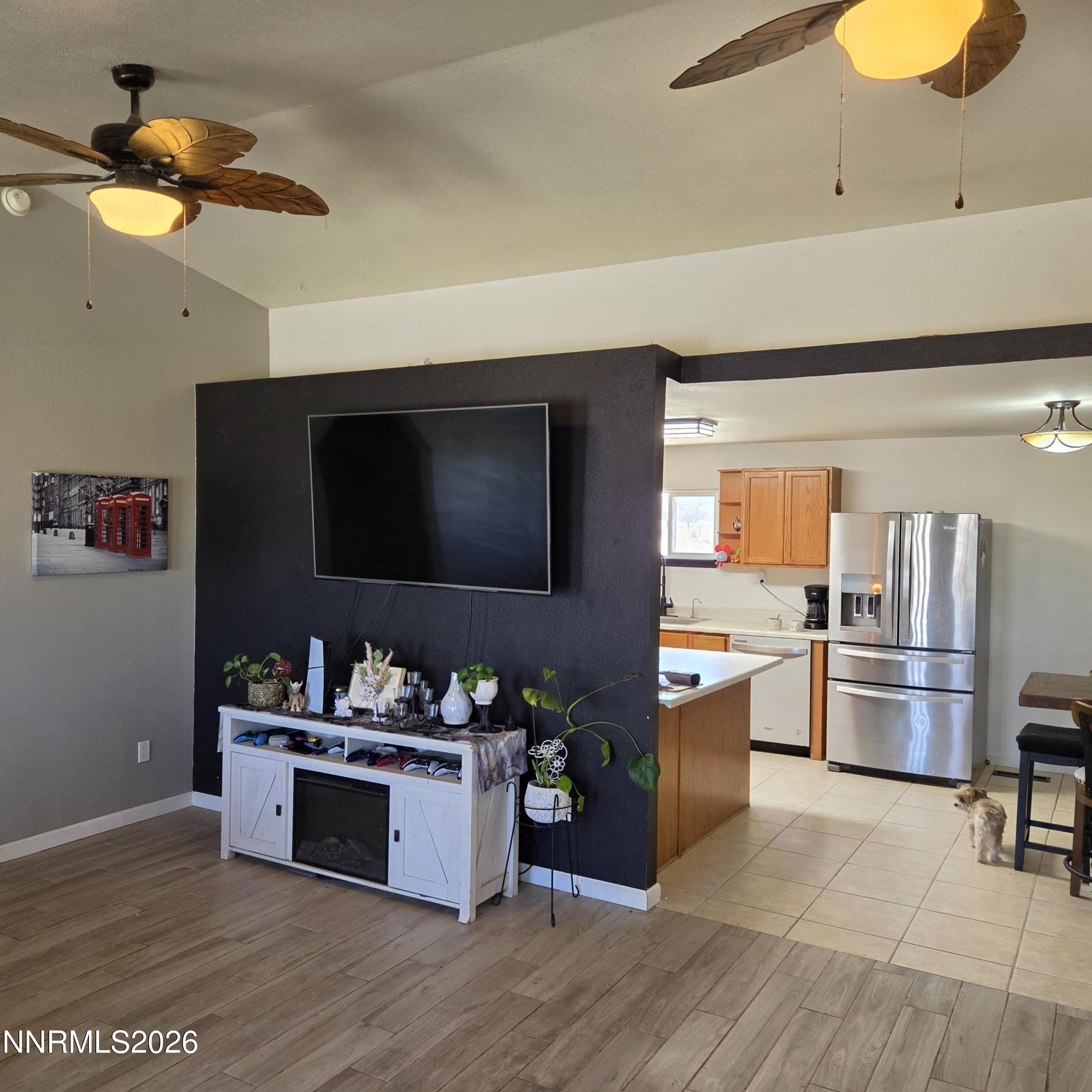 1080 Tarzyn Road Fallon, NV 89406 - Photo 12 of 41 a living room with stainless steel appliances furniture and a flat screen tv