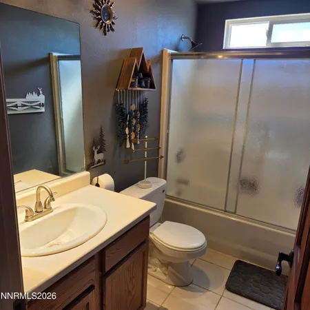 a bedroom with furniture and a wooden floor