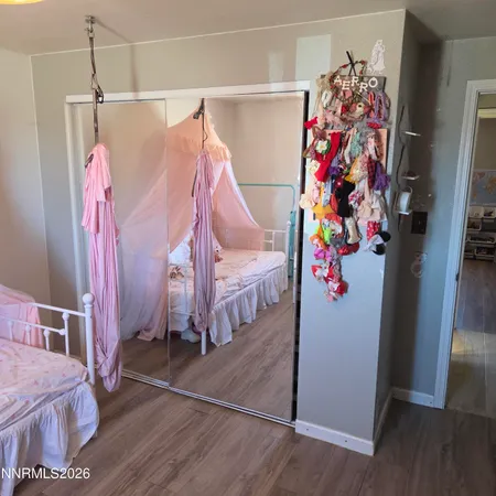 a kitchen with stainless steel appliances a sink a stove a microwave a sink a refrigerator and cabinets