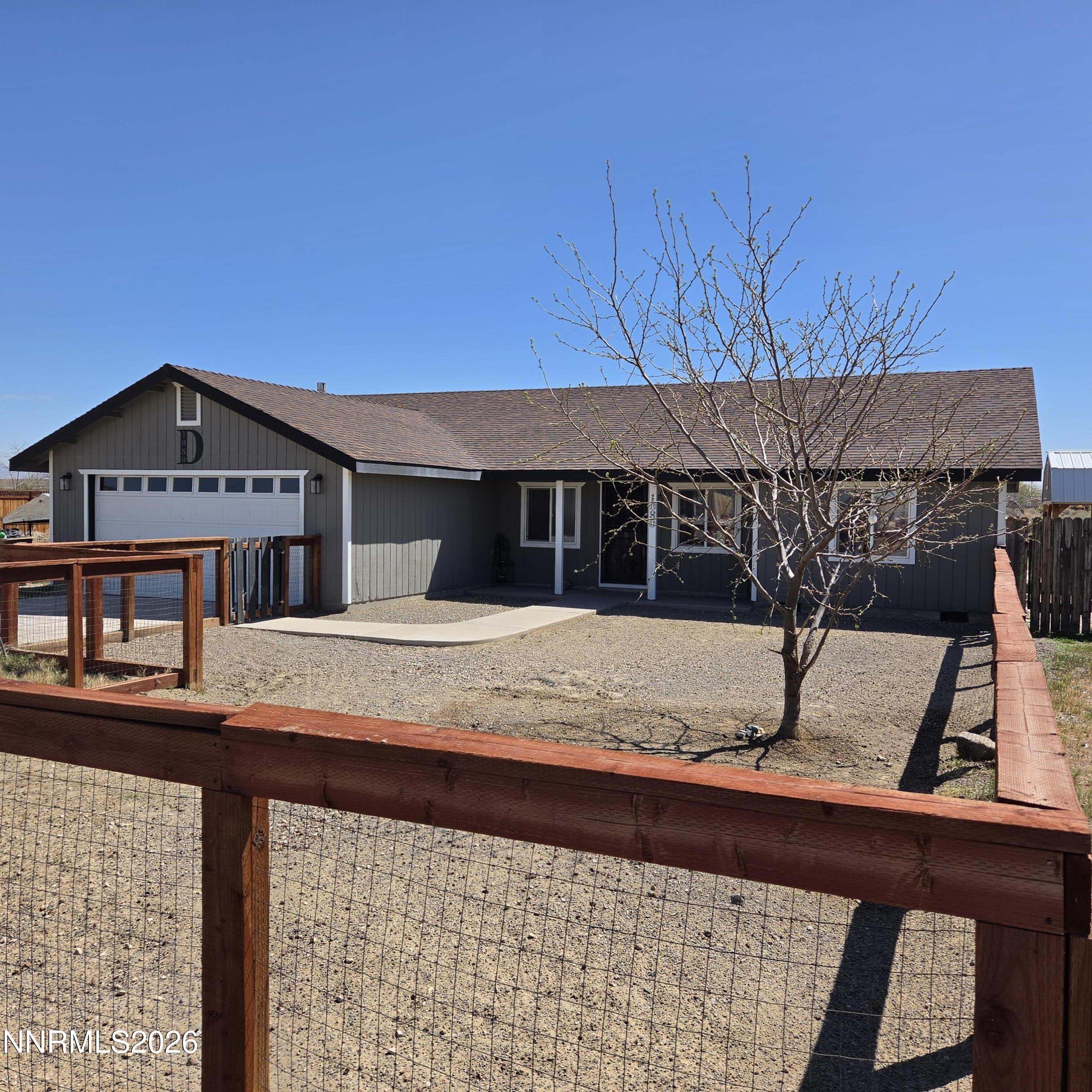 1080 Tarzyn Road Fallon, NV 89406 - Photo 2 of 41 a view of a house with a snow on the wall