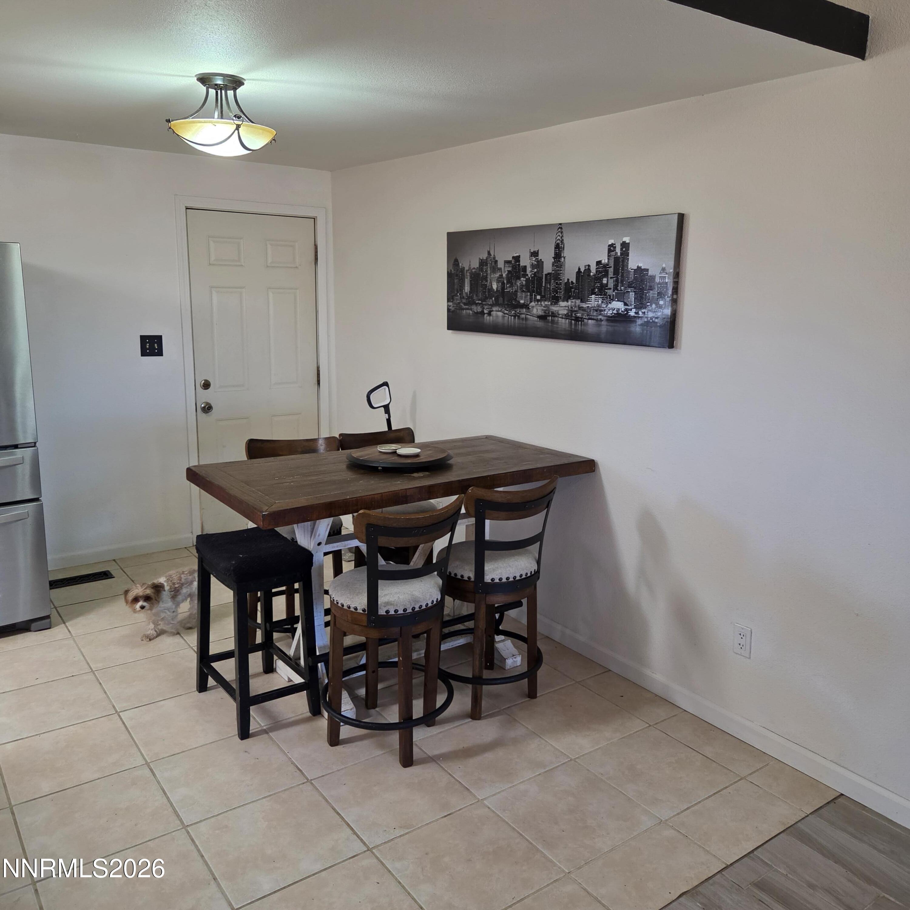 1080 Tarzyn Road Fallon, NV 89406 - Photo 21 of 41 a dining room that has a table and chairs in it