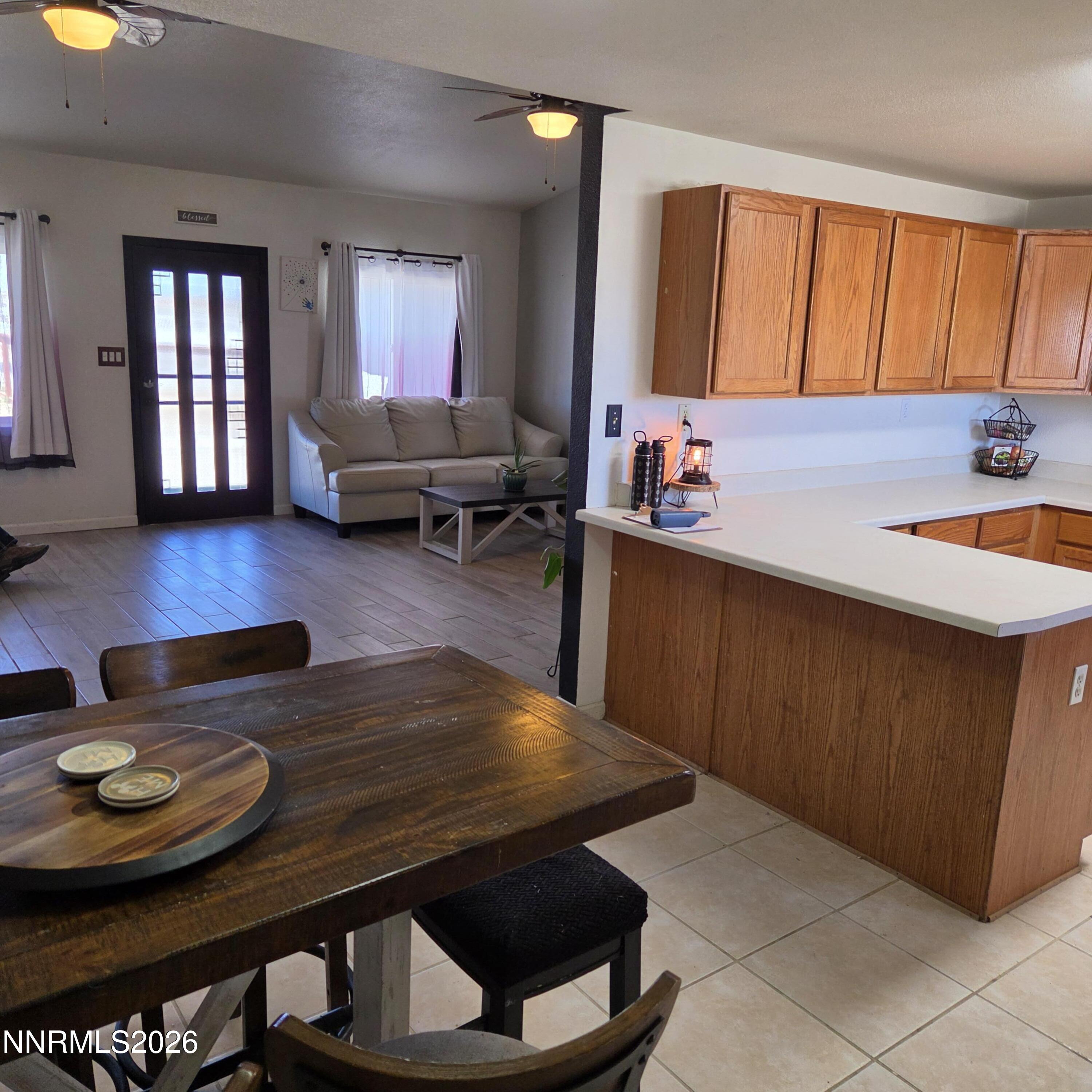 1080 Tarzyn Road Fallon, NV 89406 - Photo 24 of 41 a kitchen with a table chairs and wooden floor