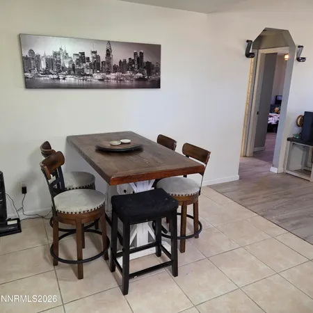 a bedroom with a bed and a television