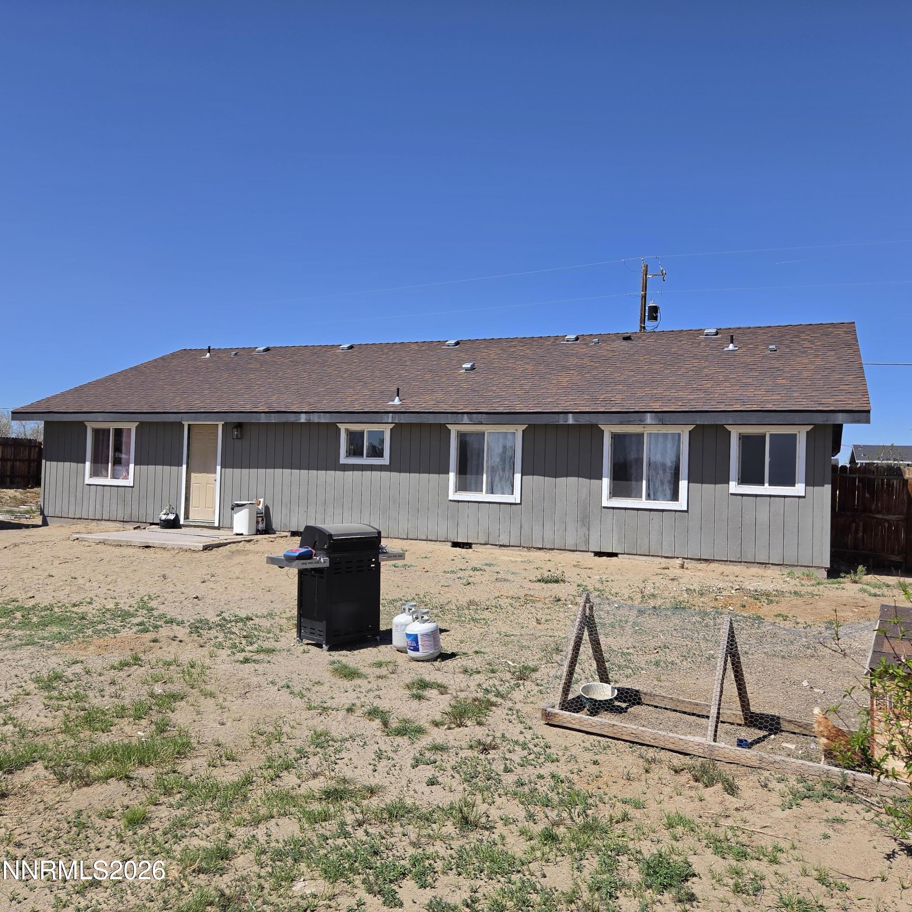 1080 Tarzyn Road Fallon, NV 89406 - Photo 4 of 41 a view of a house with backyard and sitting area
