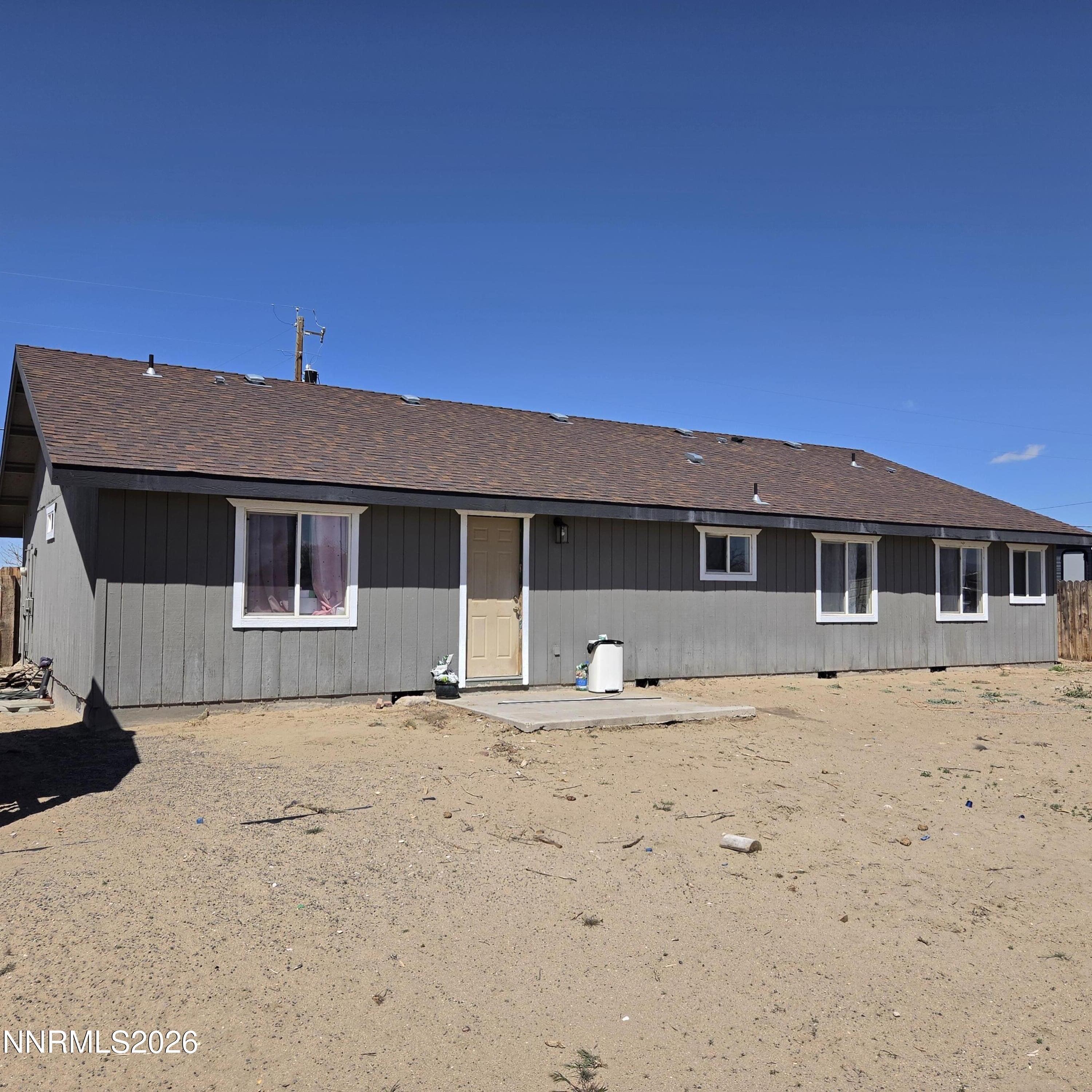 1080 Tarzyn Road Fallon, NV 89406 - Photo 5 of 41 a front view of a house with a yard