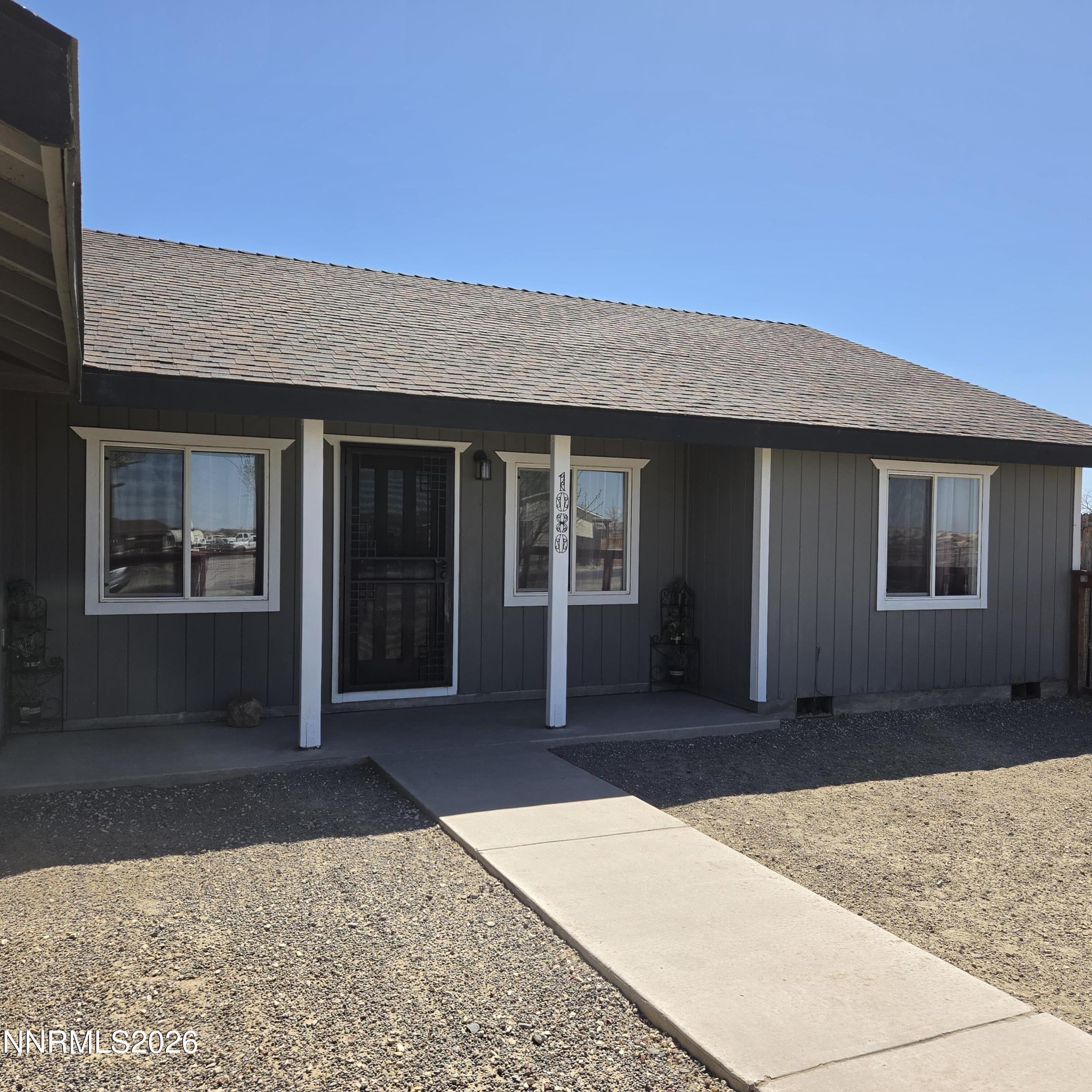 1080 Tarzyn Road Fallon, NV 89406 - Photo 6 of 41 a front view of a house with a yard