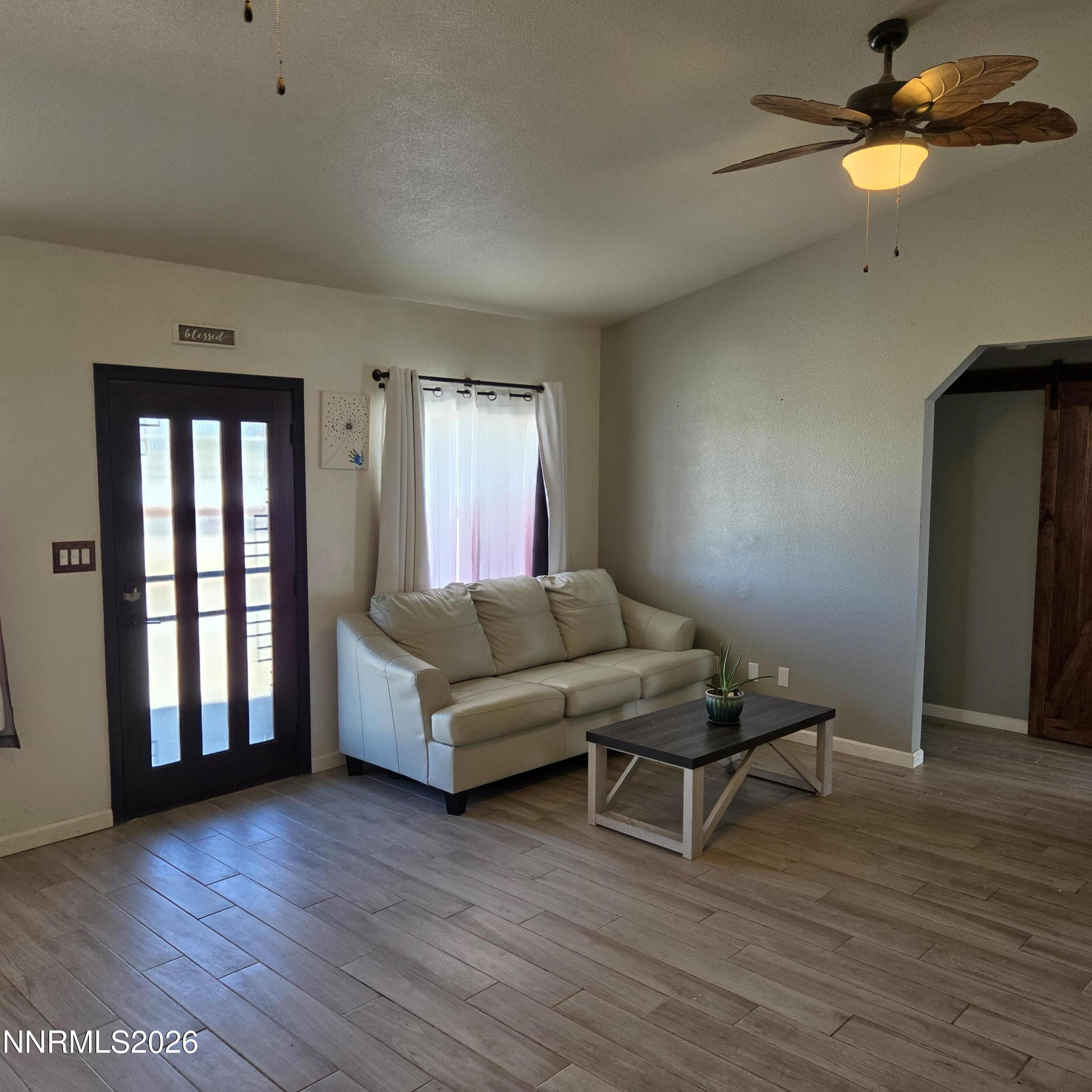 1080 Tarzyn Road Fallon, NV 89406 - Photo 9 of 41 a living room with furniture and a wooden floor