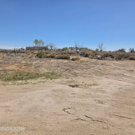 a living room with furniture and a ceiling fan
