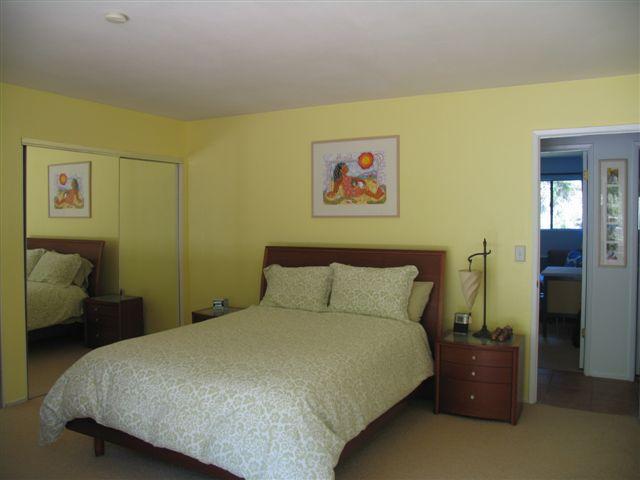 519 Fellowship Road Santa Barbara, CA 93109 - Photo 10 of 16 a bedroom with a bed and wooden floor