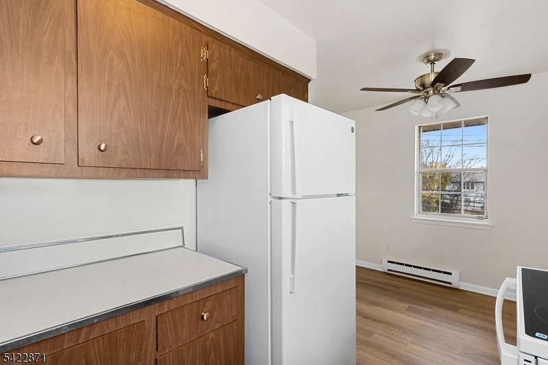 145 Arnot Street, Unit 4B Lodi, NJ 07644 - Photo 12 of 21 a view of cabinets with wooden floor