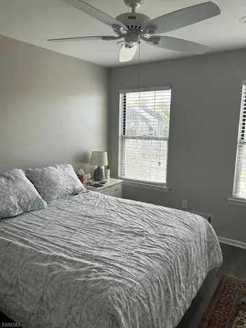 a bedroom with a large bed and a window