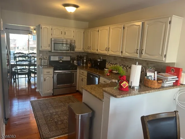 a view of a dining room with furniture and window