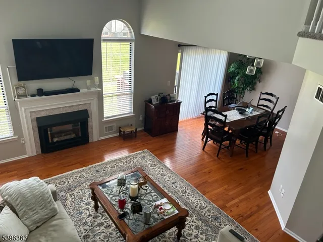a living room with furniture fireplace and flat screen tv