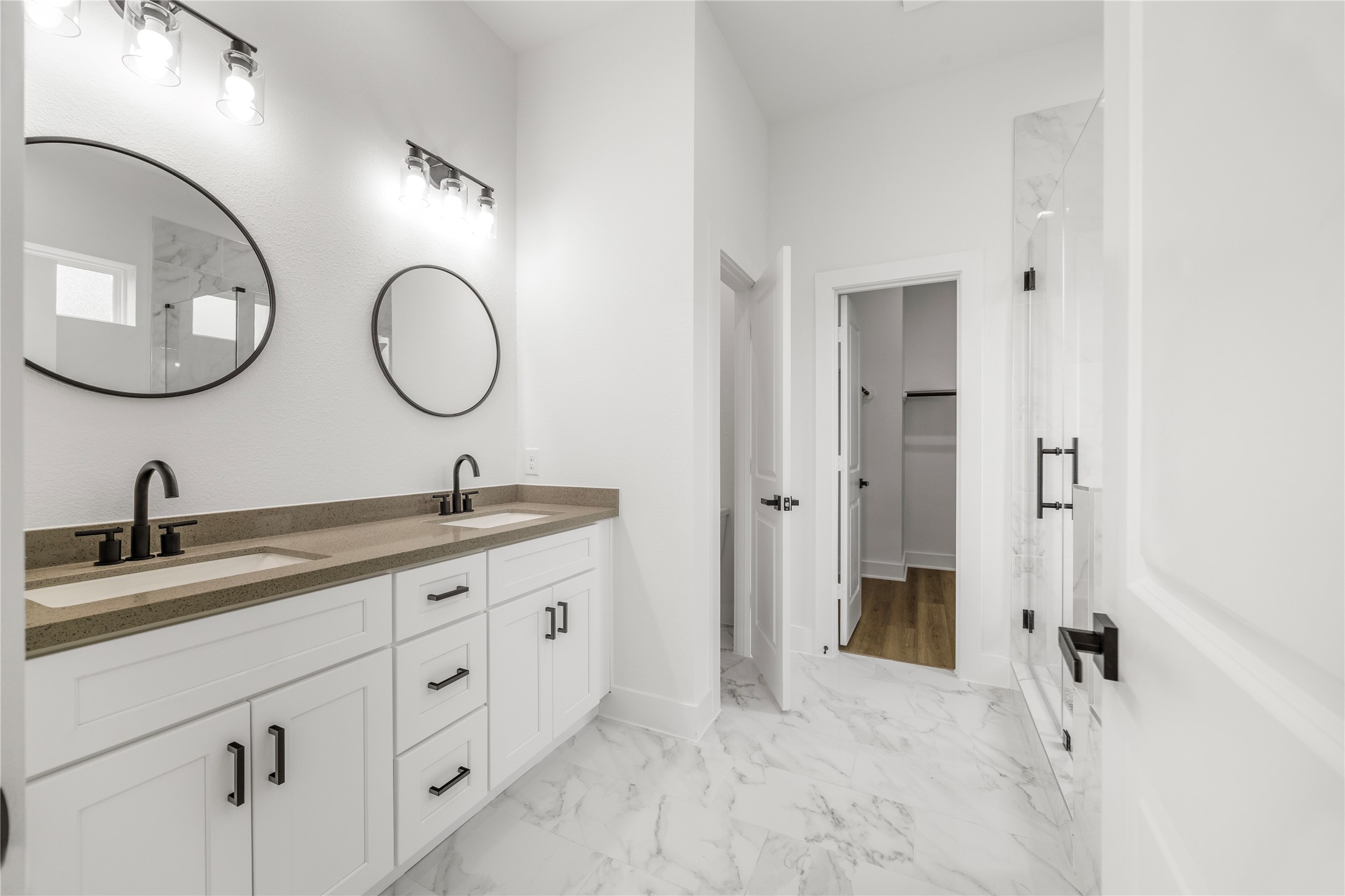 7901 Cora Street, Unit B Houston, TX 77088 - Photo 14 of 21 a bathroom with a granite countertop double vanity sink and a mirror