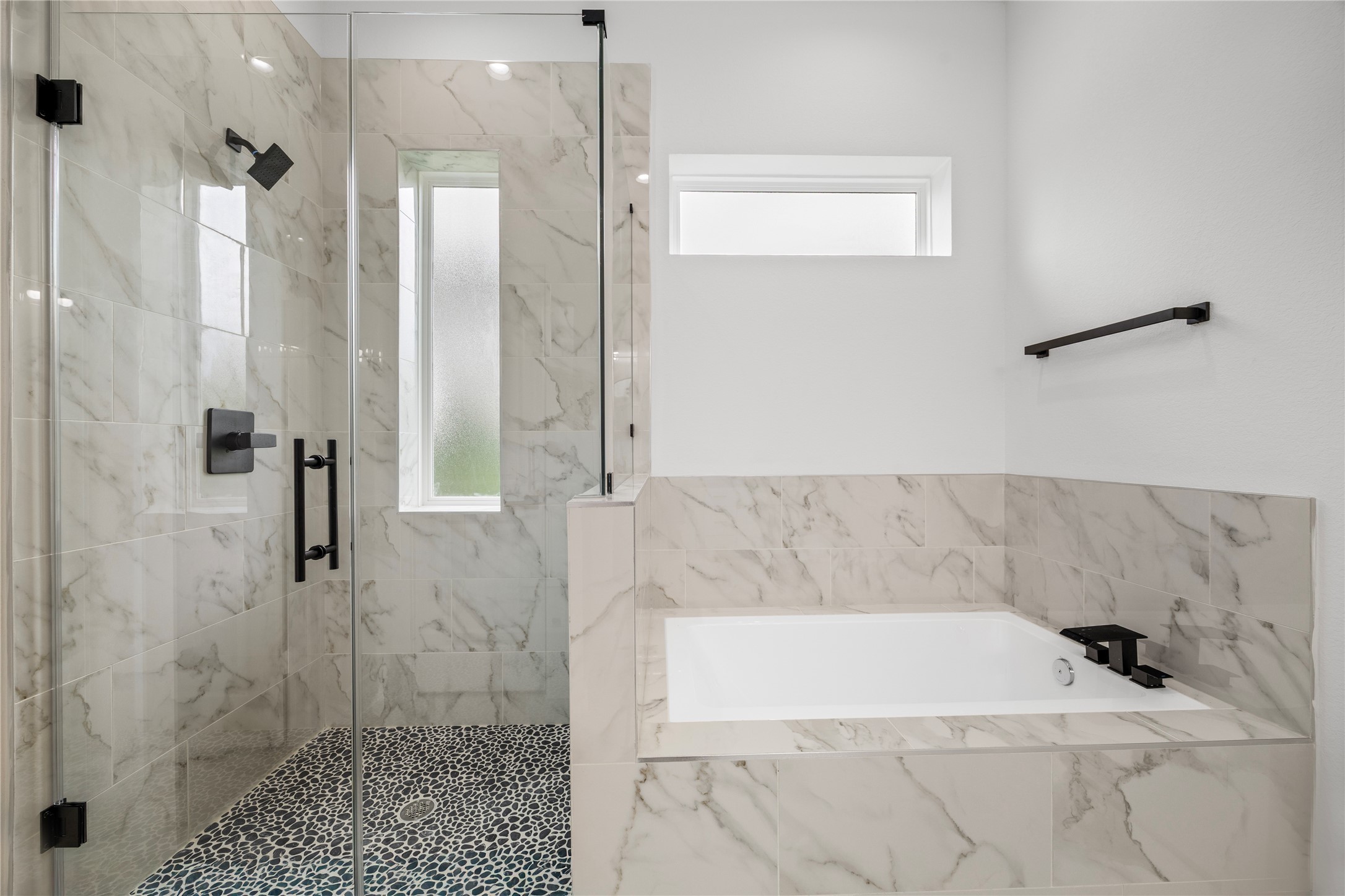 7901 Cora Street, Unit B Houston, TX 77088 - Photo 17 of 21 a bathroom with a bathtub and a shower