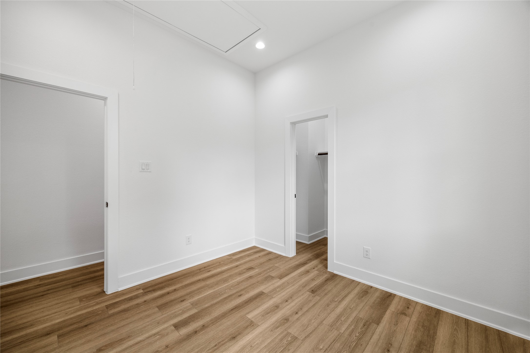 7901 Cora Street, Unit B Houston, TX 77088 - Photo 19 of 21 a view of an empty room with wooden floor and a window