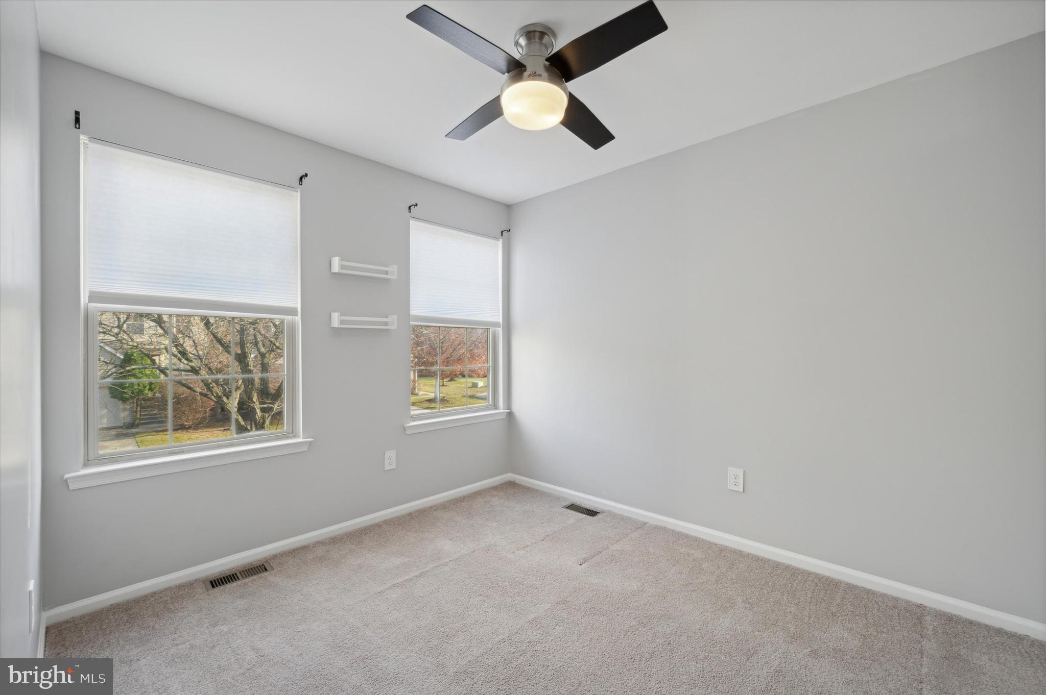 9 Meadow Lane Delran, NJ 08075 - Photo 9 of 15 an empty room with windows and fan