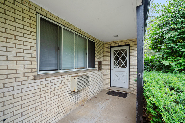 235 East Palatine Road, Unit 1B Palatine, IL 60067 - Photo 2 of 10 a view of front door of house
