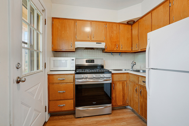 235 East Palatine Road, Unit 1B Palatine, IL 60067 - Photo 4 of 10 a kitchen with a stove and a refrigerator