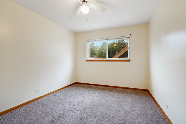 235 East Palatine Road, Unit 1B Palatine, IL 60067 - Photo 5 of 10 an empty room with a window
