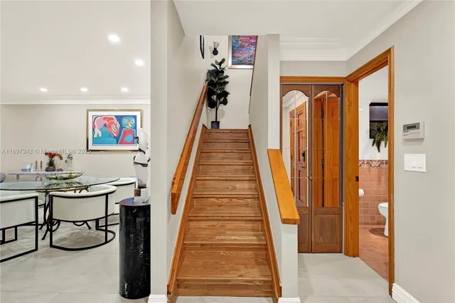 a view of a hallway with furniture and entryway