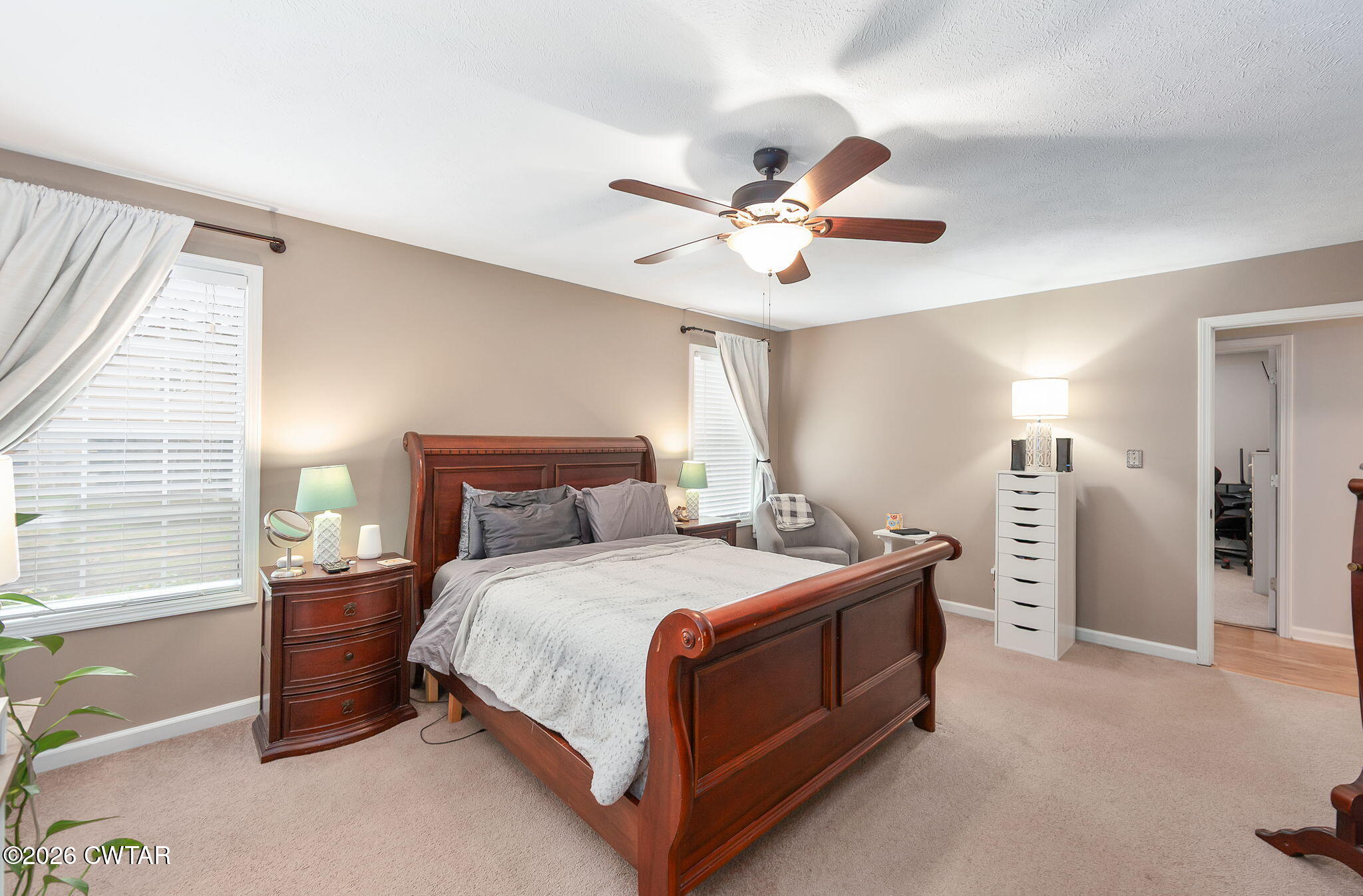 44 Ginger Lane Bells, TN 38006 - Photo 16 of 37 a bedroom with a bed and a chandelier