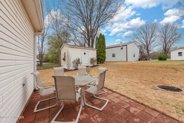 a view of a patio with a yard