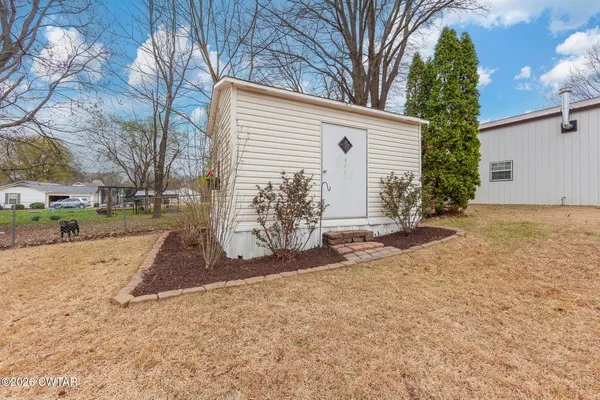 a view of a backyard with plants