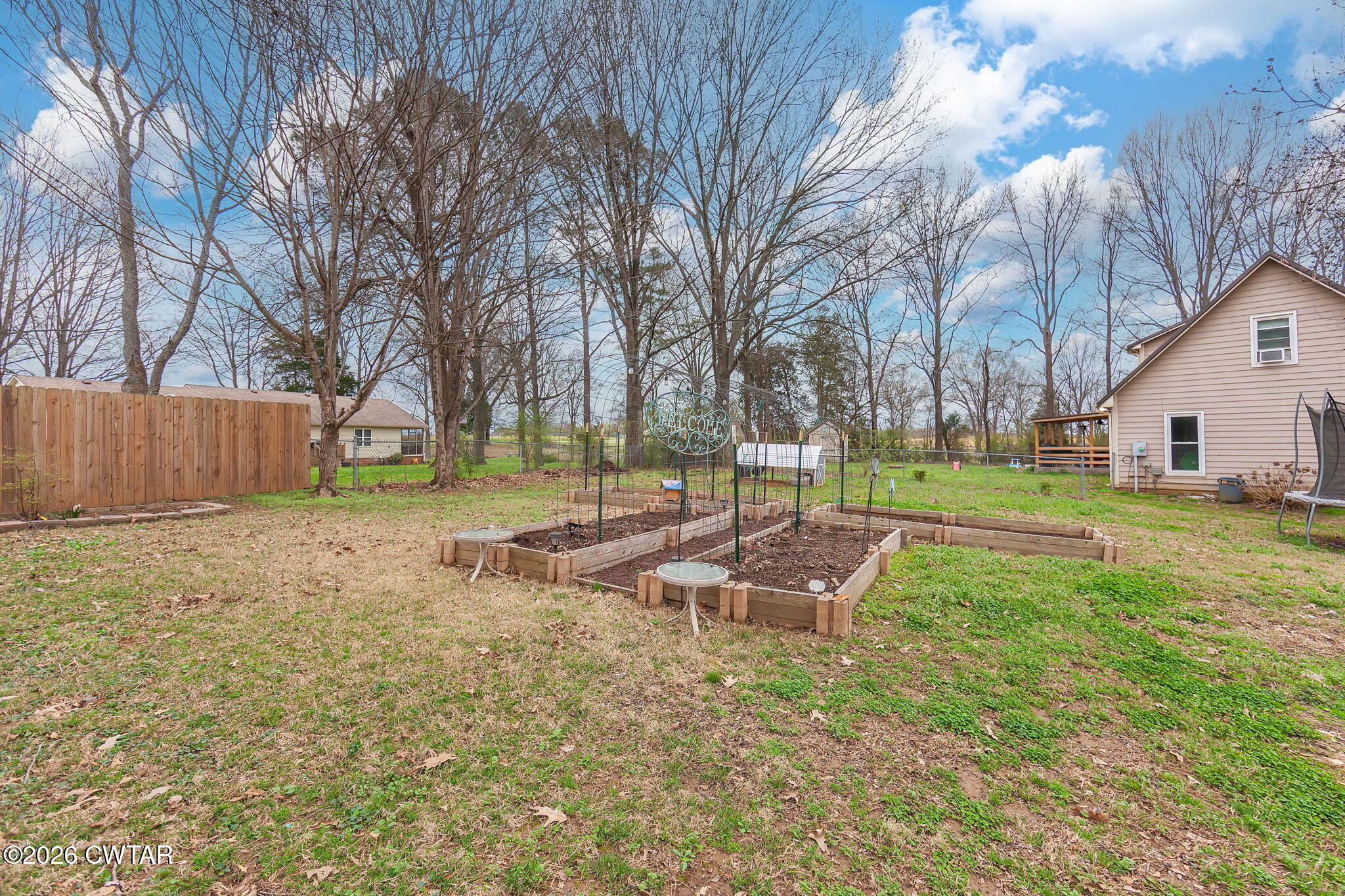 44 Ginger Lane Bells, TN 38006 - Photo 26 of 37 a view of a house with backyard and a tree