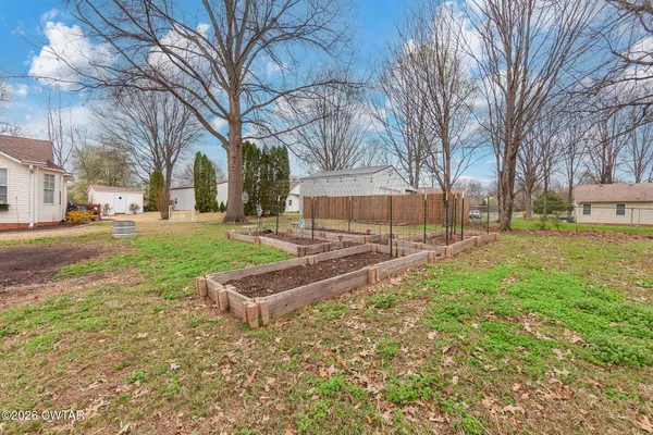 a sign board with yard in front of it