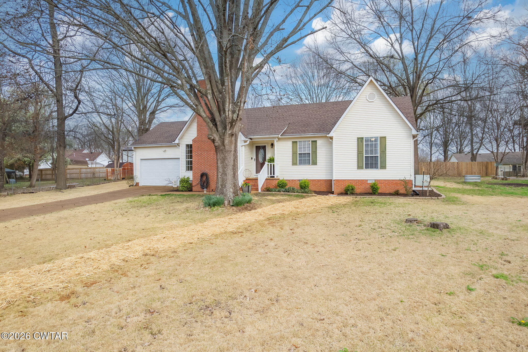 44 Ginger Lane Bells, TN 38006 - Photo 35 of 37 a front view of house with yard and trees in the background
