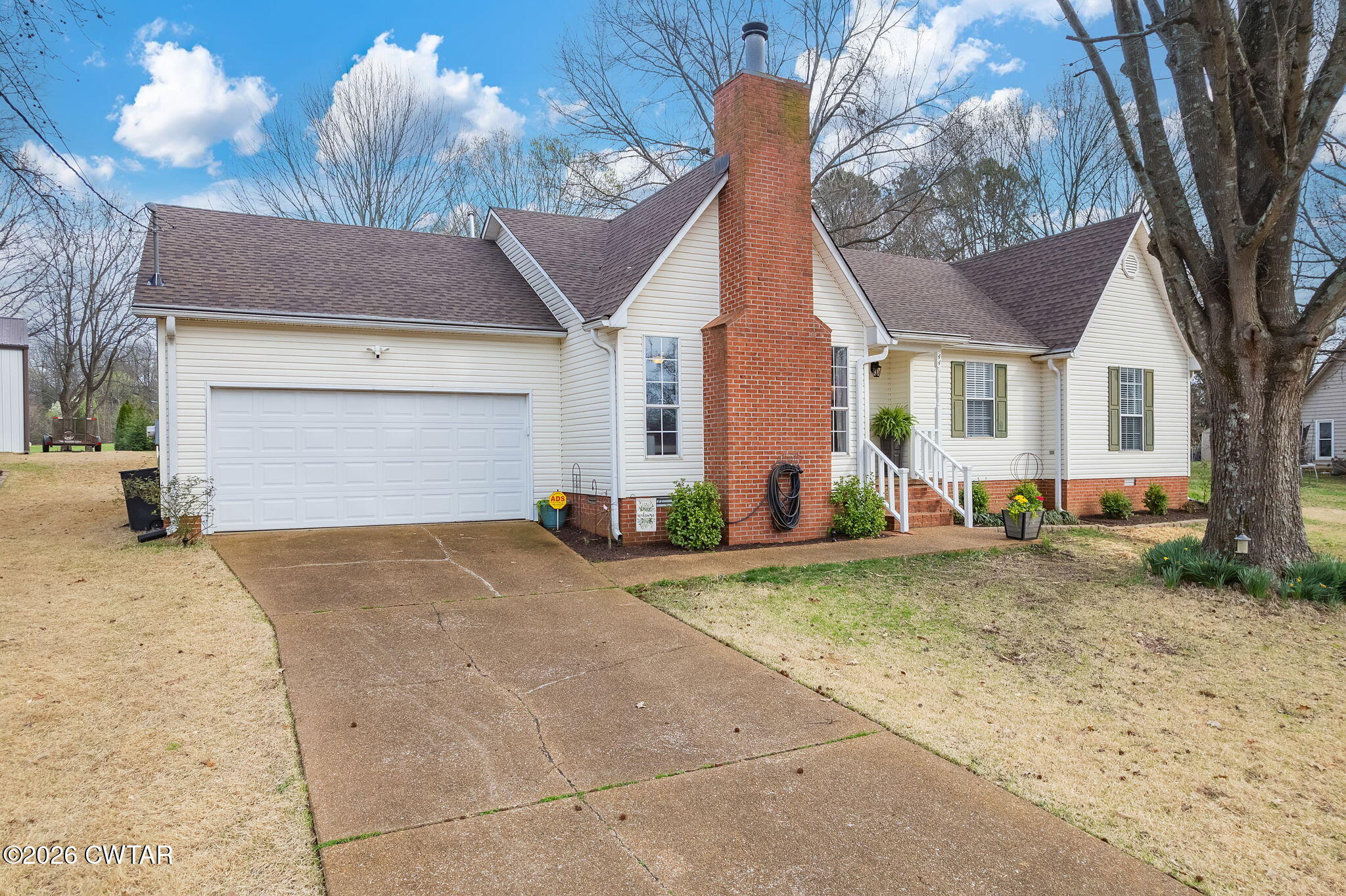 44 Ginger Lane Bells, TN 38006 - Photo 37 of 37 a view of a house with a yard and large tree