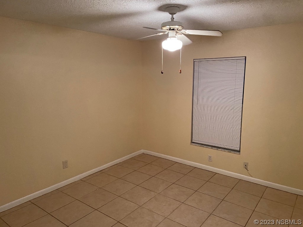 2352 Fern Palm Drive Edgewater, FL 32141 - Photo 11 of 12 an empty room with a chandelier fan