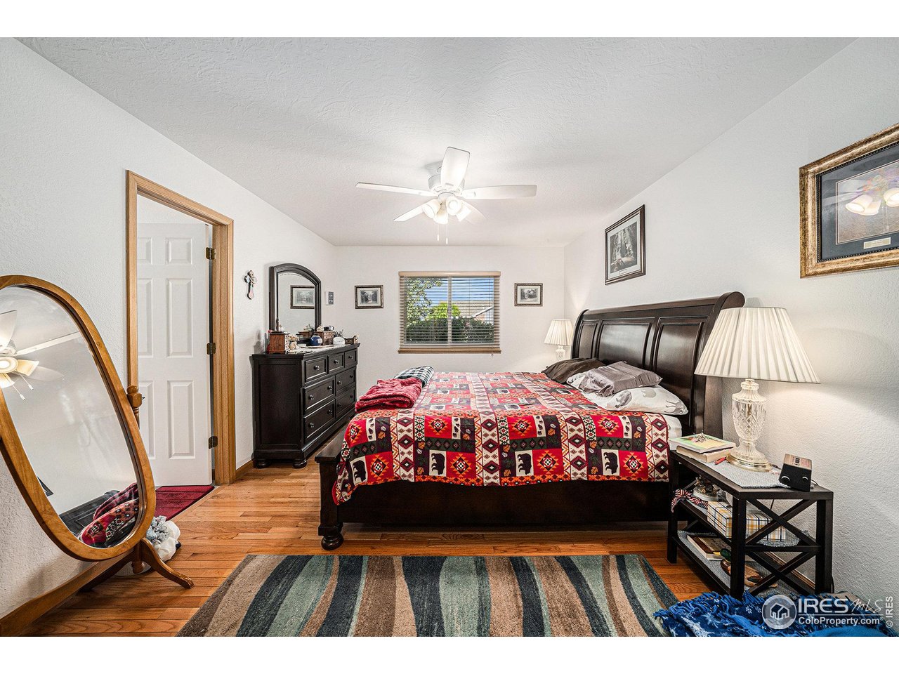 3182 50th Avenue Greeley, CO 80634 - Photo 13 of 21 a bed room with a bed window and a couch