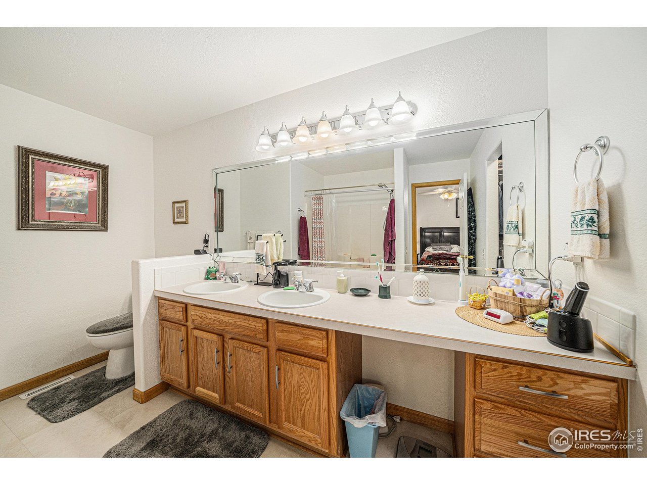 3182 50th Avenue Greeley, CO 80634 - Photo 15 of 21 a bathroom with a sink double vanity granite and a mirror