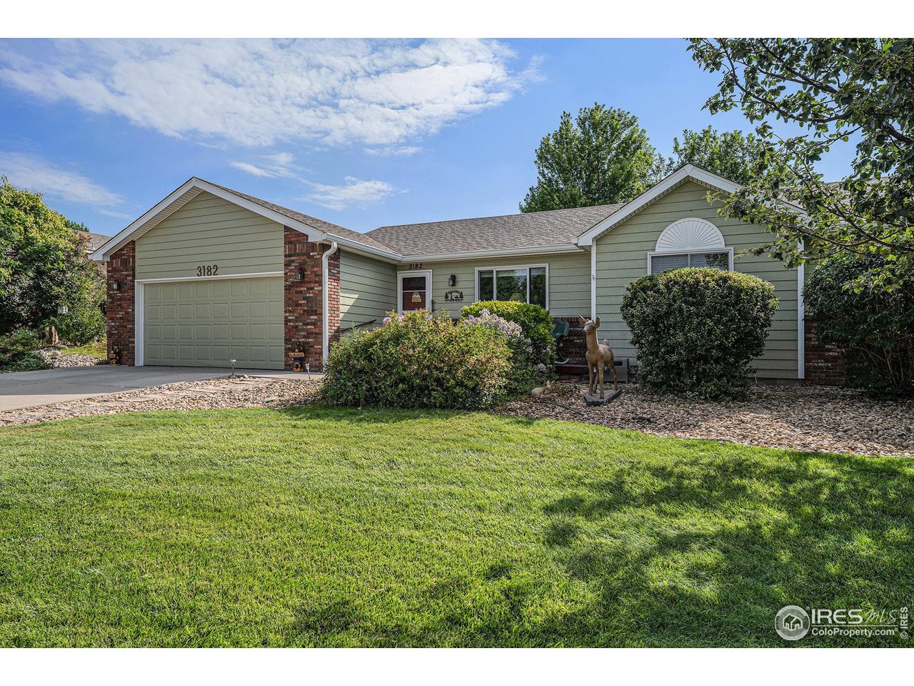 3182 50th Avenue Greeley, CO 80634 - Photo 3 of 21 a house with green field in front of it
