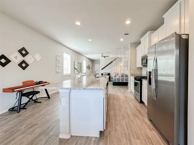 a bathroom with a sink toilet and a mirror