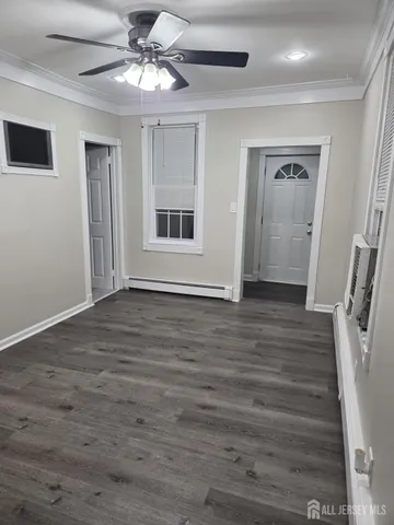 a view of entryway with wooden floor