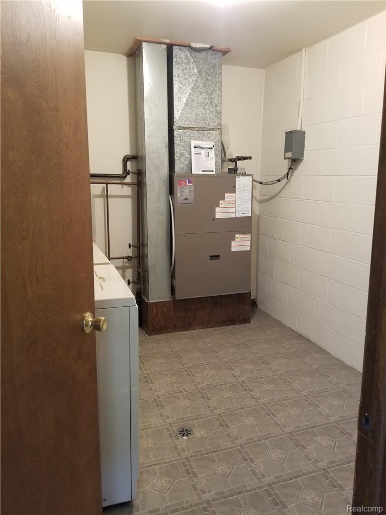 2229 North Milford Road Highland, MI 48357 - Photo 21 of 25 Newer Combo Furnace/Ac Unit