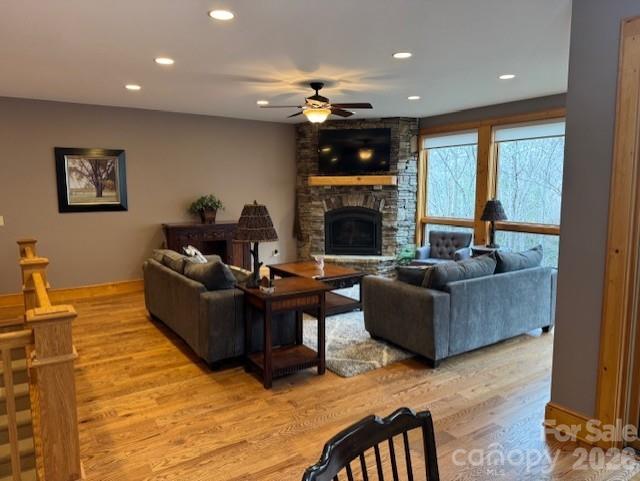 89 Springhouse Drive, Unit A4 Elk Park, NC 28622 - Photo 2 of 40 a living room with furniture and a fireplace